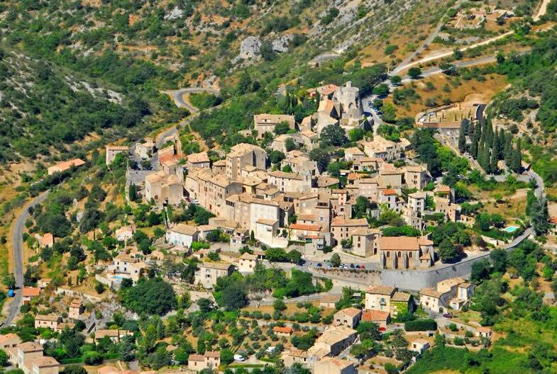 Surrounded by fields of lavender, Simiane La Rotonde - Simiane-la-Rotonde | Secret World Trip Planner