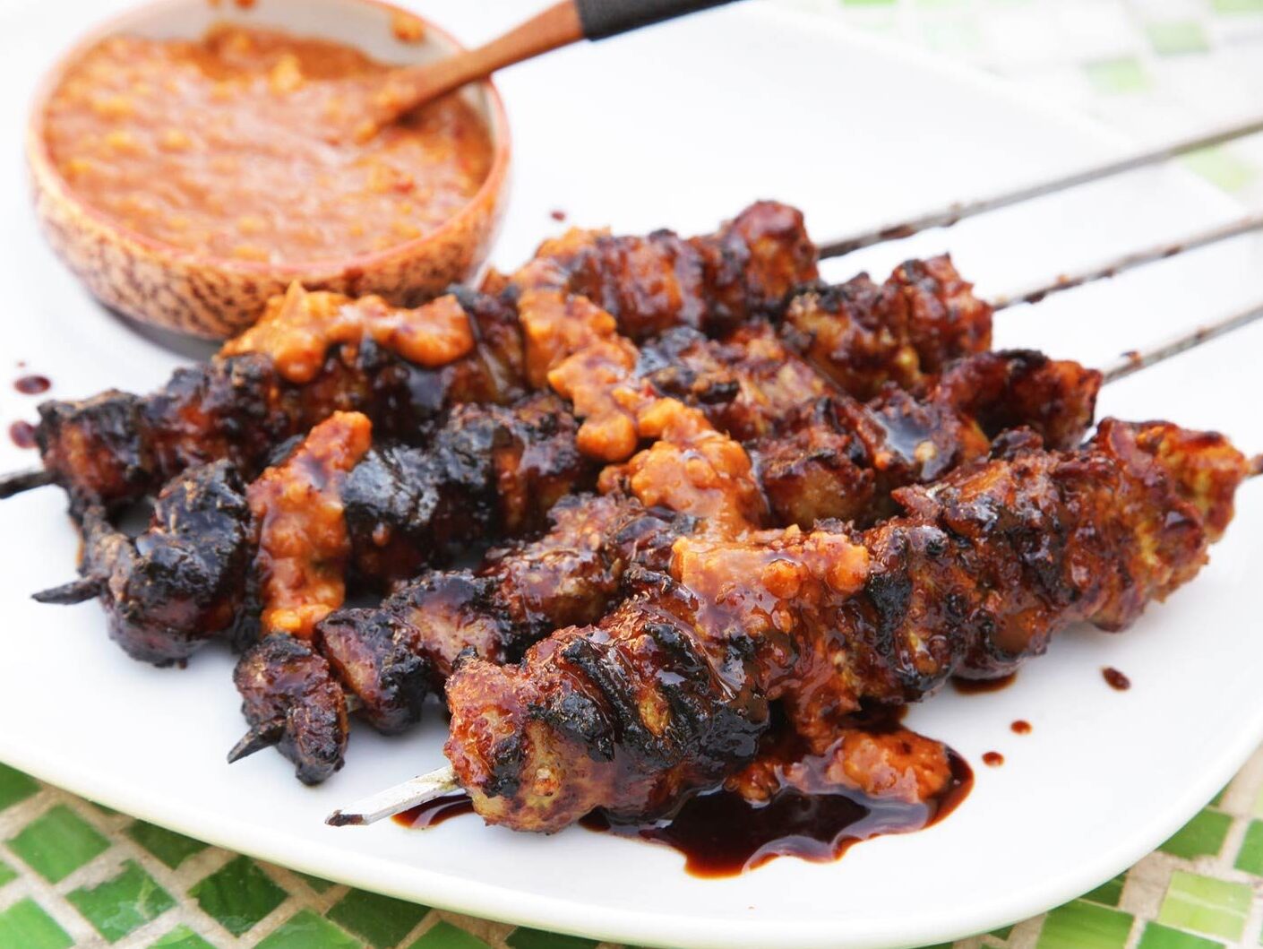 Sate or “satay” is marinated,skewered and grilled meat — Bali