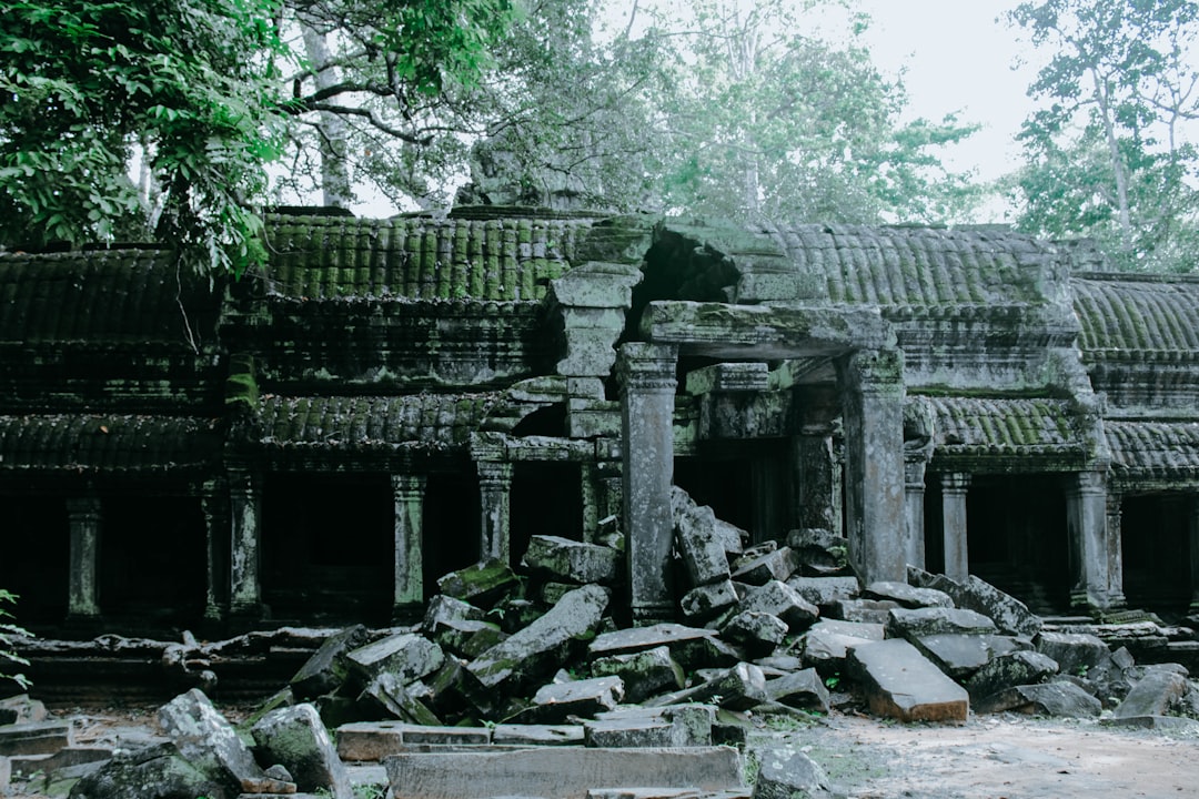 Angkor Wat at Dawn: Towers in Mist and Reflections - Wat Po | Secret World Trip Planner